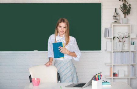 Photo for Female student on lesson lecture in classroom at high school or college. Learning and education concept - Royalty Free Image
