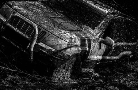 Photo for Off-road travel on mountain road. Off road sport truck between mountains landscape. Jeep crashed into a puddle and picked up a spray of dirt. Off-road vehicle goes on the mountain - Royalty Free Image