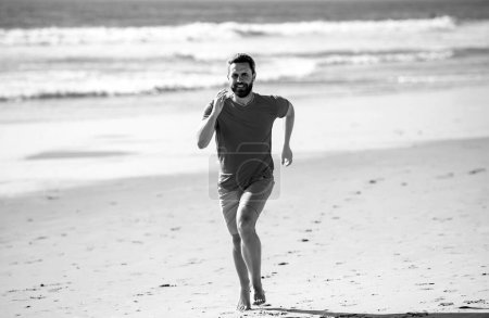 Photo for Male runner athlete run on sandy beach. Man running - Royalty Free Image