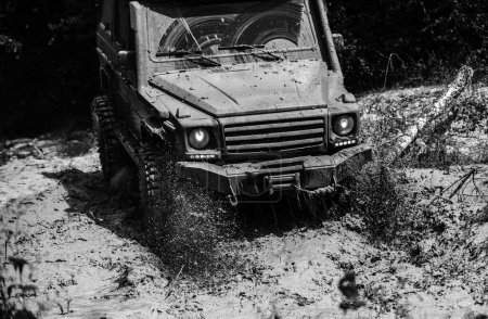 Mud and water splash in off-road racing. Best Off Road Vehicles. Travel concept with big 4x4 car. Track on mud. 4x4 Off-road suv car. Offroad car. Safari. Road adventure. Adventure travel
