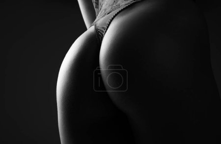 Téléchargez les photos : Sexy butt girl in lingerie. Luxury ass. Huge buttocks. Night sexy background. Beautiful ass of sensual girl - en image libre de droit