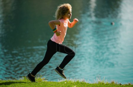 Photo for Child boy runners run in park. Sporty young kid jogging and training outdoor. Morning running with children - Royalty Free Image