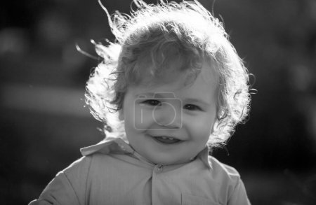 Photo for Baby child enjoy the summer on the nature in the park outdoor. Baby face closeup. Funny little child close up portrait. Blonde kid, smiling emotion face - Royalty Free Image