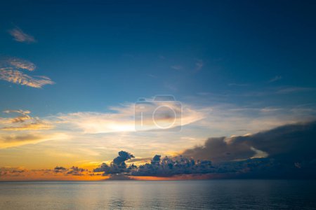 Photo for Sunset on sea. Ocean beach sunrise with calm cloudy sky - Royalty Free Image