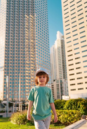 Photo for Kid in town skyscraper. City future and modern buildings - Royalty Free Image