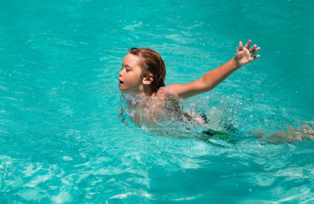 Photo for Child splashing in swimming pool. Swim water sport activity on summer vacation with child - Royalty Free Image