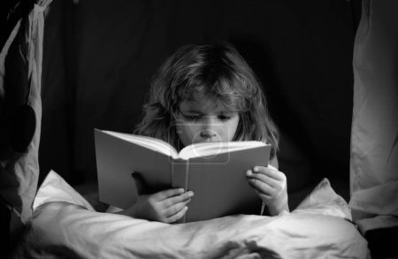 Photo for Kids reading books. Happy childhood, dreaming child read bedtime stories, fairystory or fairytale. Close up portrait of child reading story with book - Royalty Free Image