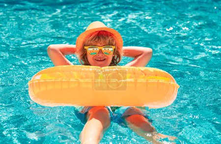 Photo for Kid boy relaxing in pool. Child swimming in water pool. Summer kids activity, watersports. Summer vacation with children. Child enjoying summer in the water in the swimmingpool - Royalty Free Image