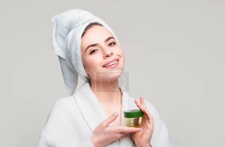 Photo for Facial treatment. Happy woman proposing a cosmetics product. Gestures for advertisement - Royalty Free Image