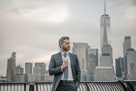 Photo for Businessman in USA. Outdoor portrait of businessman. Mature businessman in business suit standing on background of New York. Portrait of millennial businessman standing near office building in NYC - Royalty Free Image