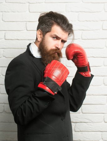 Photo for Crazy business man, conflict and fight concept. Businessman ready to fight with boxing gloves - Royalty Free Image