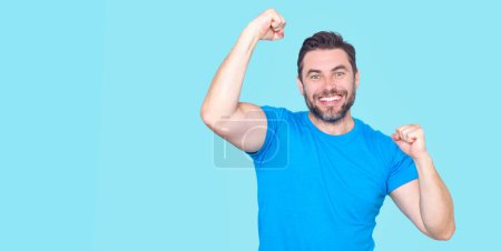 Photo for The winner. Successful man raising arms. Excited man with arms up celebrating success. Ecstatic excited male winner celebrating win. Overjoyed business man enjoy victory - Royalty Free Image