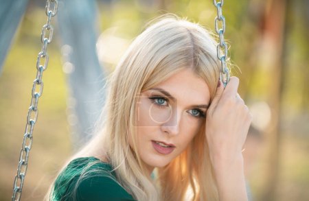 Photo for Portrait of a young thoughtful pensive woman, close up face of beautiful woman outdoor. Cheerful female model. Pretty girl enjoying summer outdoors. Positive emotion, relax and calm outside - Royalty Free Image