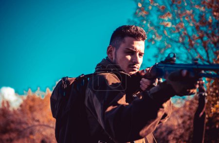 Photo for Hunter with shotgun gun on hunt. Hunter with Powerful Rifle with Scope Spotting Animals. Hunting gun - Royalty Free Image