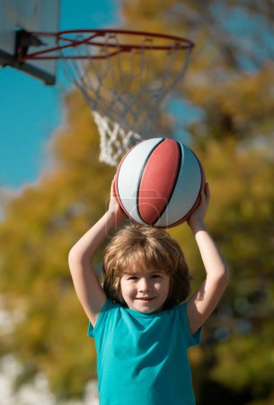 Foto de Basketball kids training game. Basket ball little Player - Imagen libre de derechos