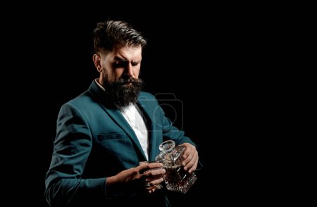 Photo for Alcohol Drink. Drinking whiskey or brandy or cognac. Bartender leather apron holding whisky cocktail in glass - Royalty Free Image