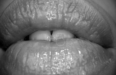 Sensual woman with sensual lips. Close-up perfect natural lip, female mouth. Plump sexy full lips. Macro face detail. Sensual forms of woman lips