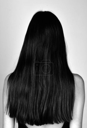 Health long hair concept. Hair treatment. Woman hair back