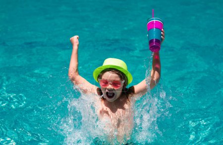Photo for Child drinking coctail in the pool. Little child boy in swimming pool. Kids swim on summer vacation. Beach sea and water fun. Summer kids cocktail - Royalty Free Image