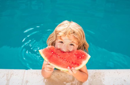 Photo for Happy kid with slice of fresh sweet watermelon smiling, while swimming in pool on summer day - Royalty Free Image