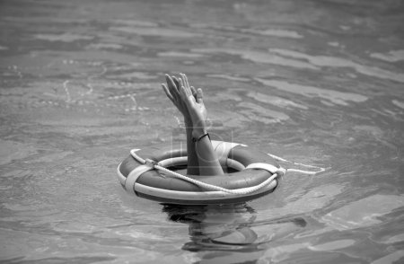 Lifebuoy help to survive concept. Support survival or save, rescue. Ring floating in a sea, life preserver. Drown people with rised hand