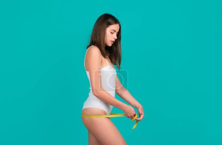 Photo for Weight loss, waist buttocks, diet and health concept. Woman measuring her butt bum - Royalty Free Image