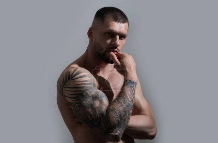 Photo for Sexy and naked muscular young man sensual posing. Sexy shirtless male model. Attractive young naked man. Sexy nude male model with strong perfect shoulders and chest - Royalty Free Image