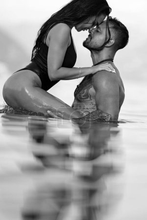 Photo for Sexy vacation. Sex on the beach. Erotic sensual couple kissing in the water. Summer sexy couples. Romantic couple in sea water. Beautiful young couple in love on the lake. Sexy couple kissing on beach - Royalty Free Image