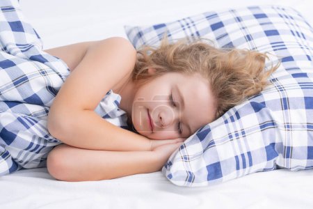 Photo for Kid sleeping on bed at home. Bedtime, kids sleeps. Child asleep on pillow, having healthy sleep - Royalty Free Image