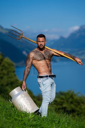Photo for Sexy farmer. Handsome shirtless man in nature. Muscular male fit body. Strong athletic man. Fit male model. Healthy handsome Athletic Man outdoor. Guy showing muscular fit body. Sexy torso - Royalty Free Image