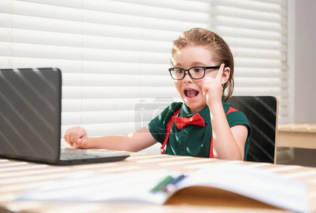 Photo for Back to school and home schooling. Happy school kid at lesson. Pupil in classroom at knowledge day. School time - Royalty Free Image