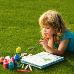 Artist kids. Schooler kids drawing in summer park, painting art. Little painter draw pictures outdoor