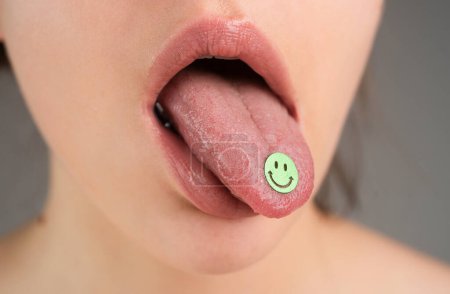 LSD. Psychedelic hallucinogens. Drug addiction Tongue with drugs