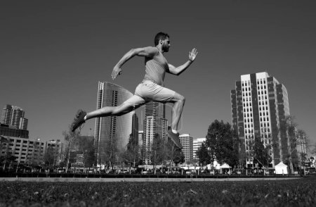 Photo for Runner man training outside. Caucasian male athlete jogging in San Diego city. Fit young jogger running - Royalty Free Image