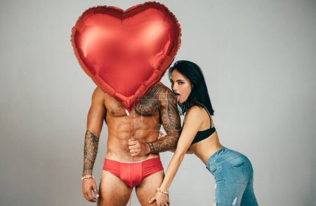 Photo for I Love You. Couple In Love. Mens Sexy Lingerie. Fetish Clothing and accessories. Party Celebration Success Concept. Intimate relationship and sexual relations. Valentines day. Red heart. - Royalty Free Image