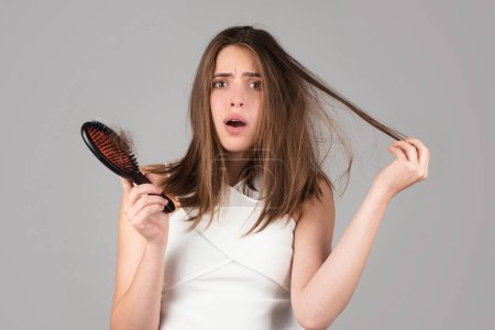 Photo for Hair loss woman with a comb and problem hair. Hairloss stressed woman and bald problems - Royalty Free Image