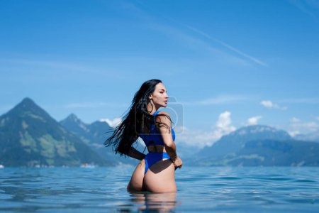 Photo for Summer beauty sexy woman in lake water. Sexy ass. Booty fit wet body. Big buttocks an slim waist. Sexy back. Beautiful bikini model splashing water - Royalty Free Image
