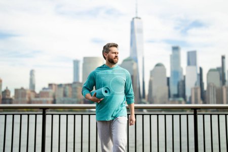 Photo for Sports man doing workout in NYC. Man athlete doing workout practice for cardio wellness. Fitness workout outdoor. Man outdoor workout. Man enjoying active lifestyle outside in park in NY near - Royalty Free Image