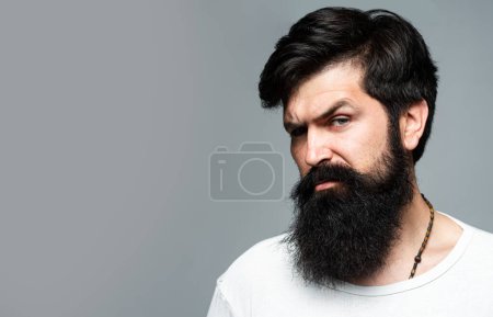 Male face profile with beard and mustache. Retro Beard. Male hair care concept. Bearded brutal hipster serious man with long beard. Barber shop. Man hair beauty. Beard Care and Facial Hair