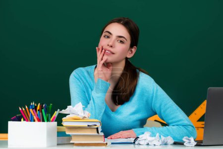 Photo for Student girl in classroom. Knowledge in College. Schoolgirl in high school. College student learning in college classroom. Education concept. Lesson and homework in College - Royalty Free Image
