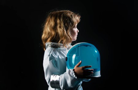 Photo for Portrait of funny kid with astronaut helmet. Child boy playing astronaut, spaceman - Royalty Free Image