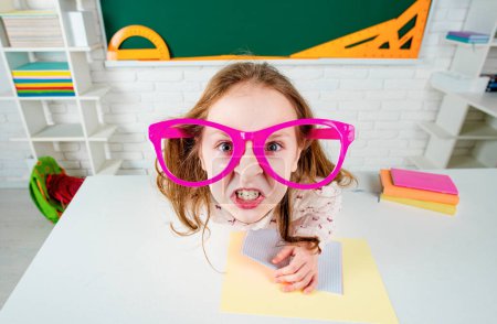 Photo for Funny pupil in classroom. Little ready to study. Back to school. Supporting pupils at school, kids Education - Royalty Free Image