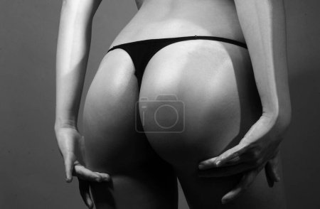 Foto de Sexy butt, sensual ass, buttocks in bikini, thong lingerie close up - Imagen libre de derechos