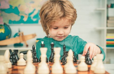 Photo for Clever concentrated and thinking child while playing chess. Pupil kid thinking about his next move in a game of chess. Kids chess school. Preschooler or schoolboy - Royalty Free Image