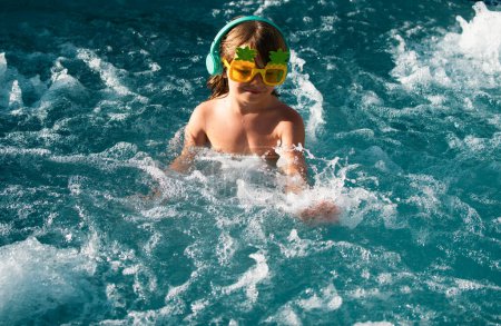Happy young kid in swimming pool, smile relax face swimmer kid have fun activity