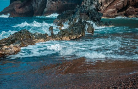 Photo for Sea shore with stones, ocean seascape. Sea waves over rocks on wild stone beach. Tropical sea relax - Royalty Free Image
