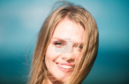 Photo for Portrait of a young woman, close up face of beautiful woman outdoor. Cheerful female model. Woman with romantic smile - Royalty Free Image