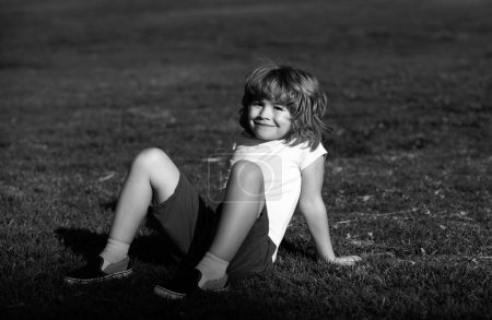 Photo for Summer kids outdoor. Happy child enjoying summer. Kids on green grass background - Royalty Free Image