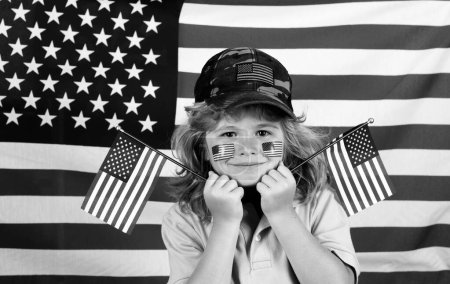Téléchargez les photos : Child american patriot. Independence day 4th of july. Child with american flag. American flag on kids cheek - en image libre de droit