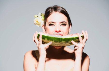 Photo for Sexy girl eating a watermelon. Fashion glamor portrait of beautiful sexy stylish young woman model with bright makeup and red lips. Summer sexy watermelon - Royalty Free Image